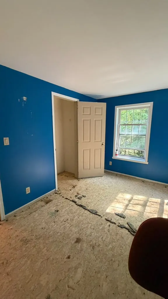 Room with deep blue walls before painting