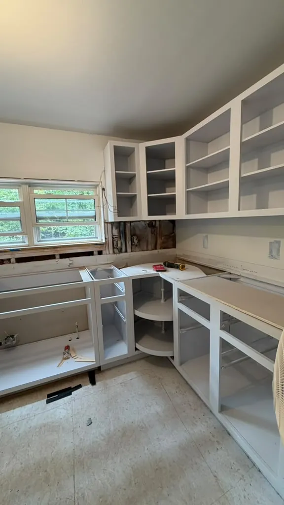 White cabinets being installed