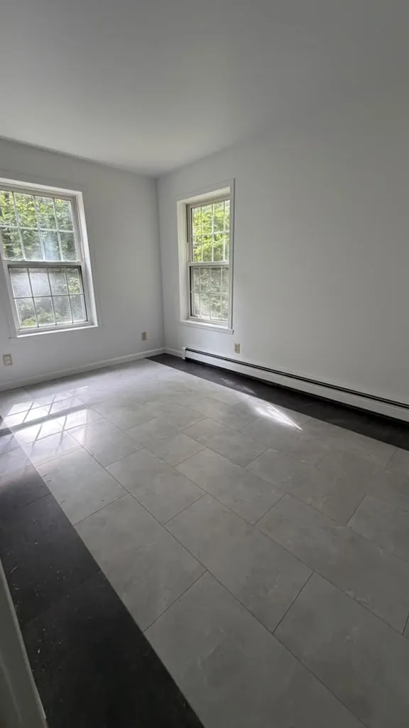 Room painted white with new flooring
